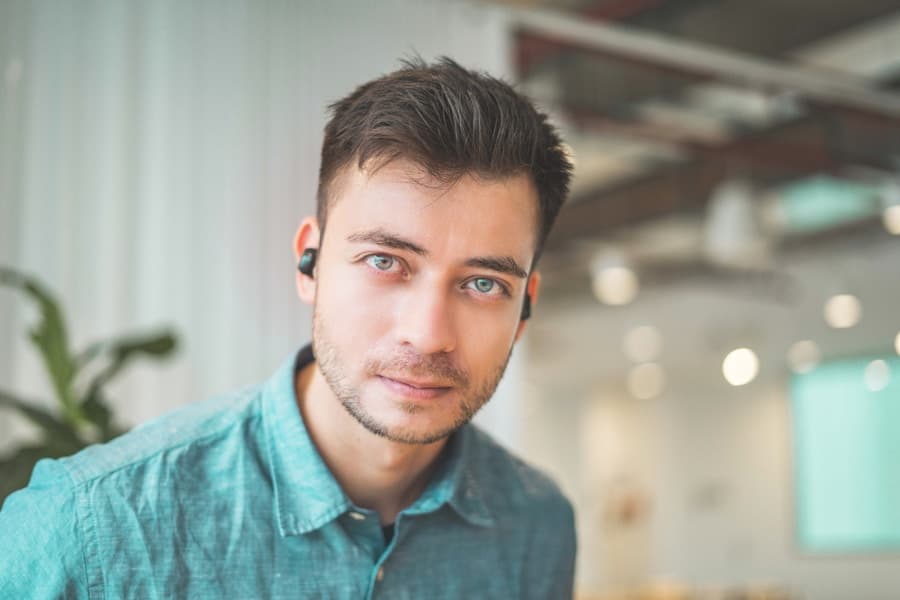 Senior operator in a denim shirt, modern office